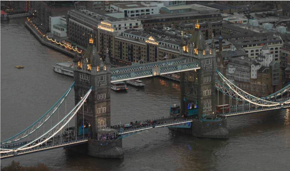 Aerial view of London at night with Tower Bridge and the River Thames